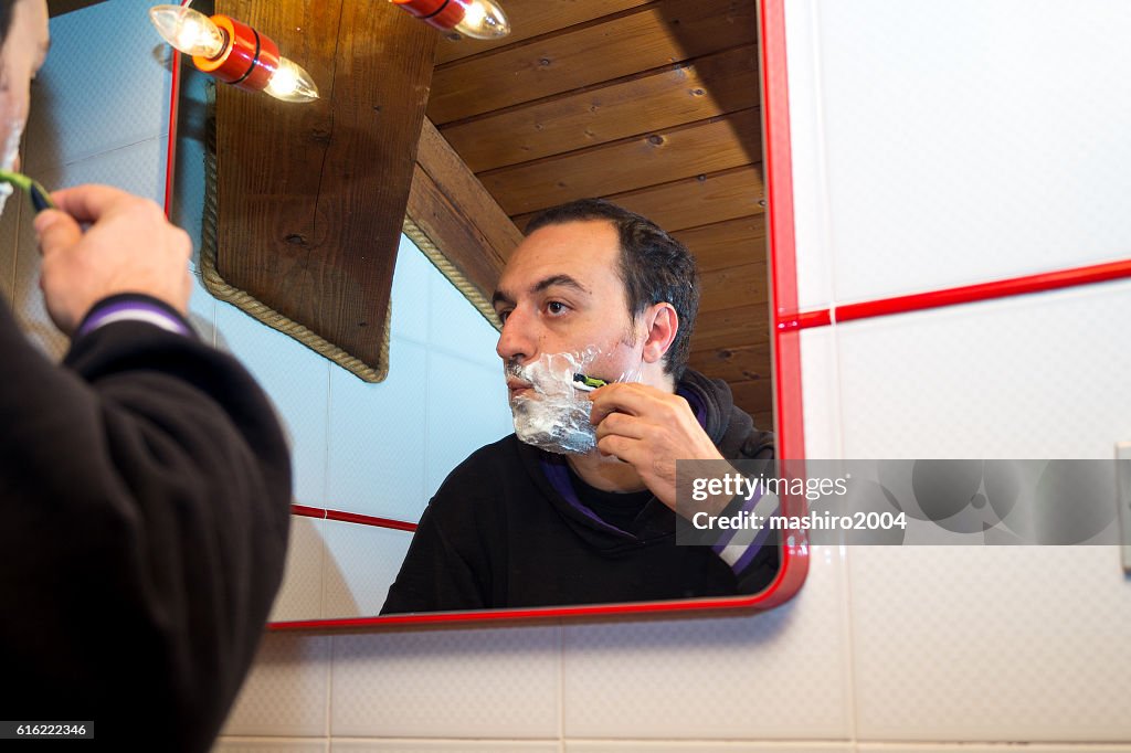 Selfie in the mirror while i shave beard