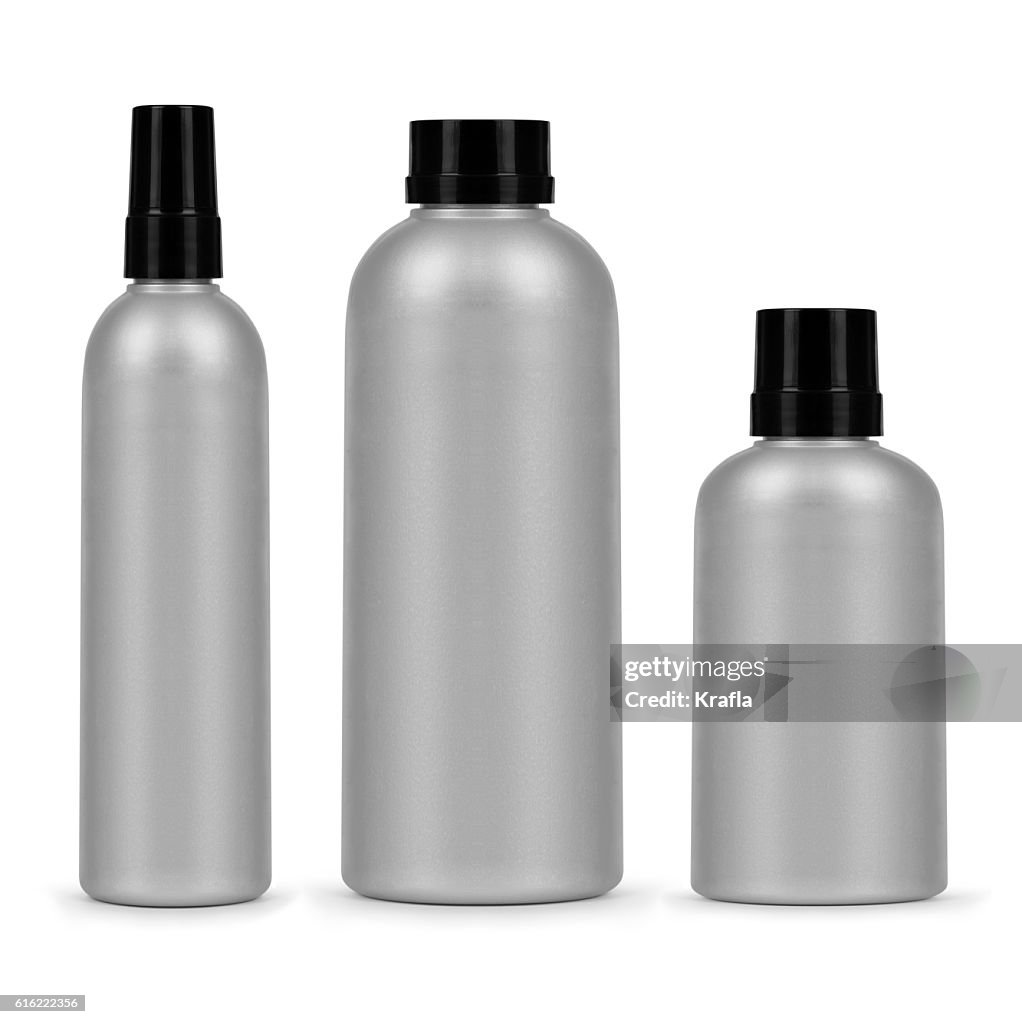 Set of three cosmetic bottles isolated on a white background