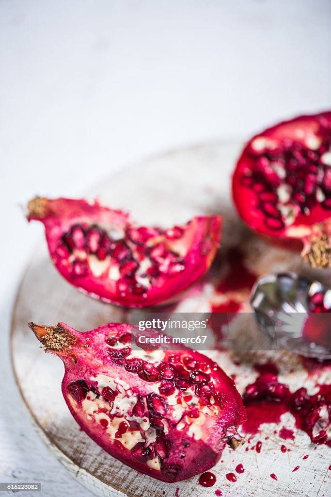 Pomegranate cut on board