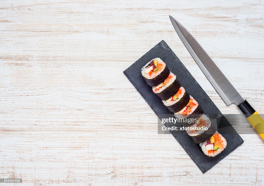 Sliced Sushi and Knife With Copy Space