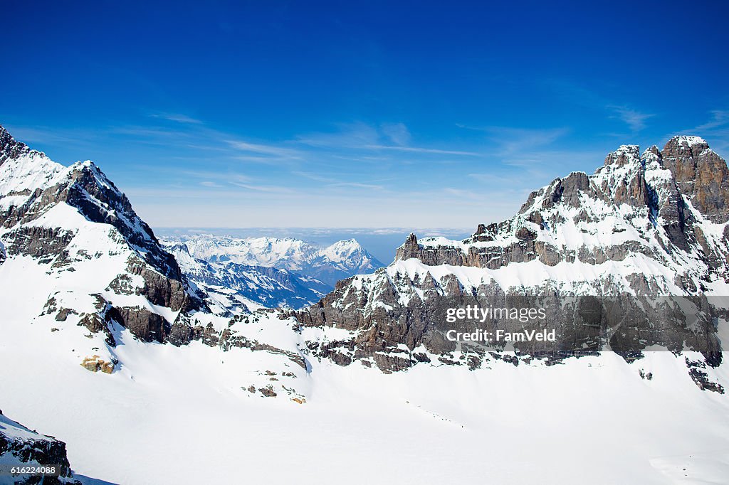 Aerial view from helicopter above glacier in Swiss Alps
