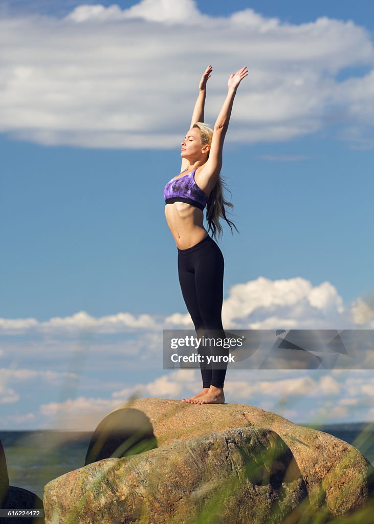 Young caucasian fitness woman practicing yoga