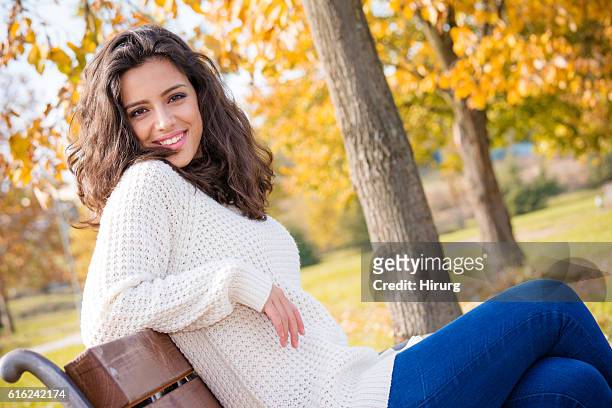 beautiful teenage girl sitting in the park - dry eye stock pictures, royalty-free photos & images