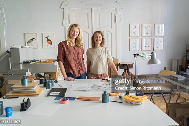 portrait of two young businesswomen in atelier - halle an der saale stock-fotos und bilder