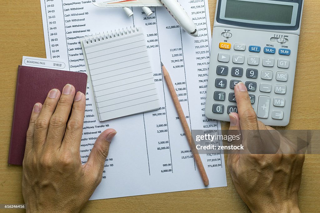 Man planning monthly budget, Finance about Travel concept