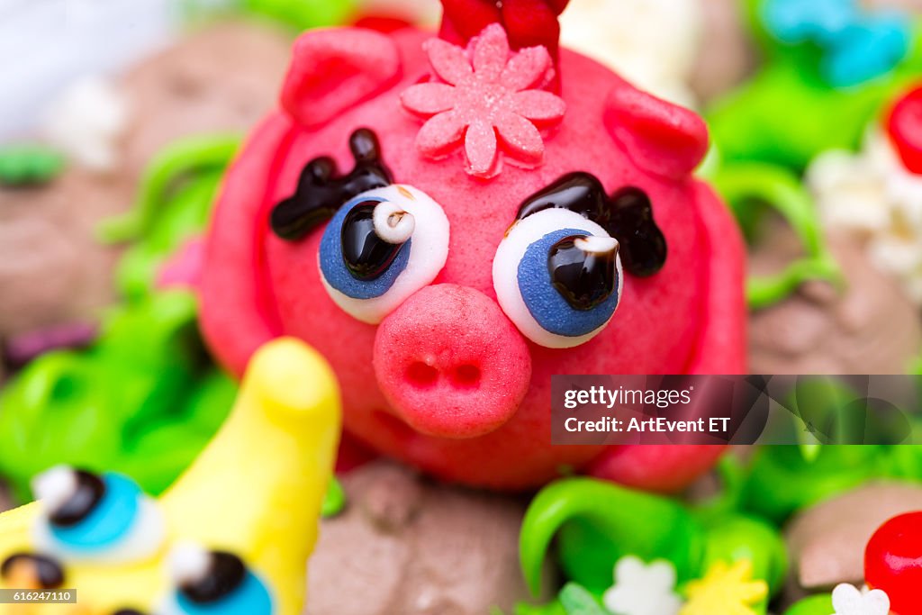 Celebration colorful cake decorated figures of animals