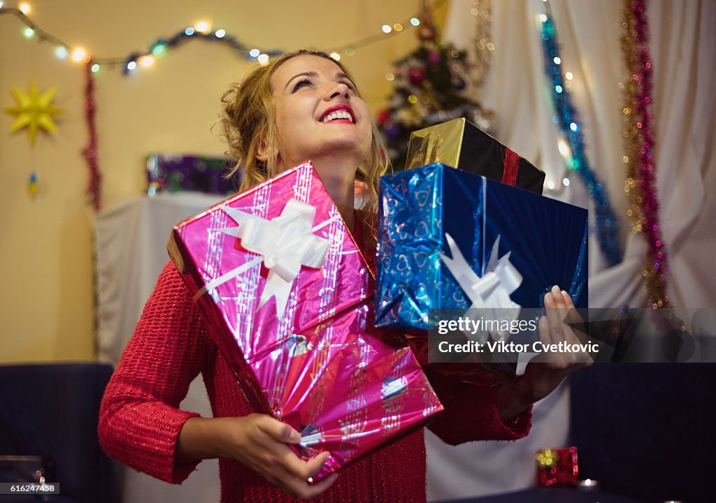 Pretty young woman with gifts.