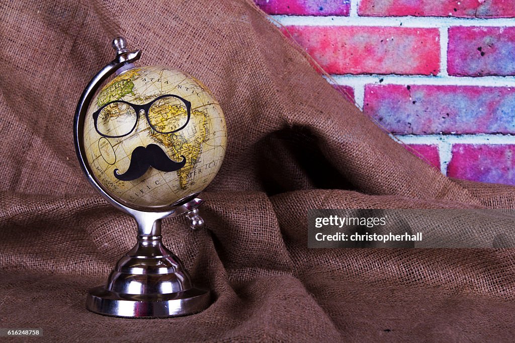 Globe with a black hipster mustache