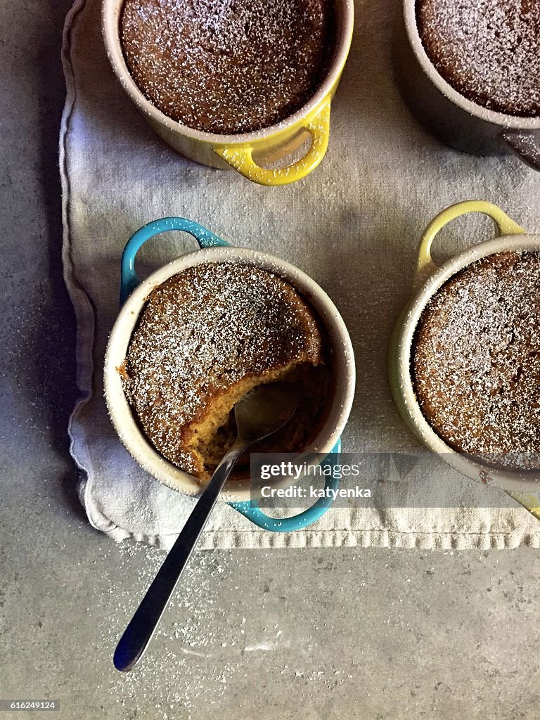 Dessert: Homemade baked gluten-free pumpkin custards in colourful ramekins