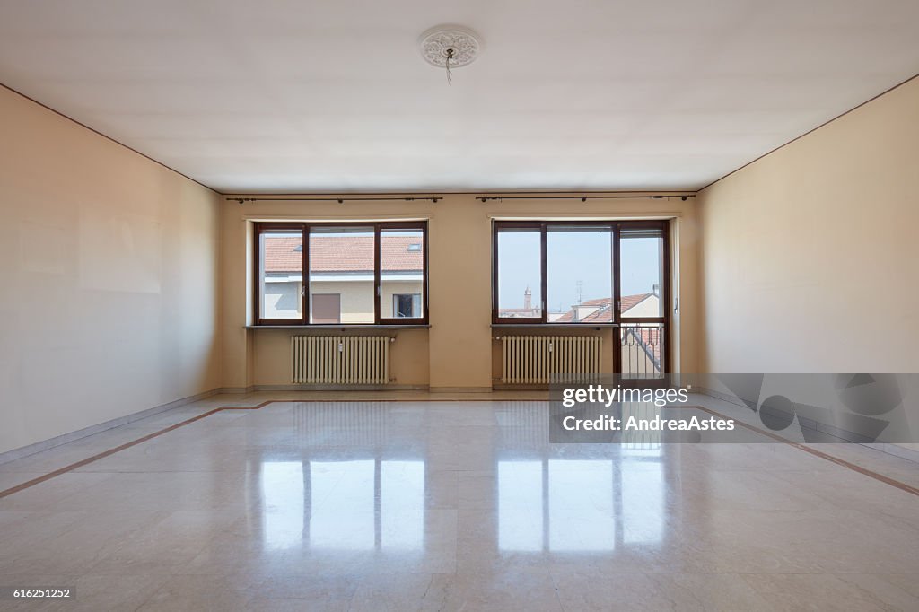 Empty living room with marble floor