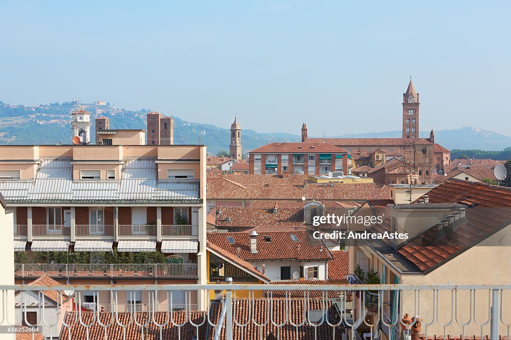 Alba rooftops with cathedral's bell tower view, Italy