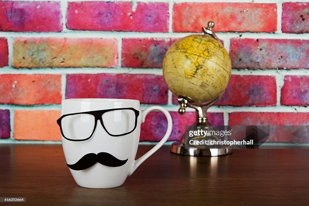 Coffee cup with a black hipster mustache