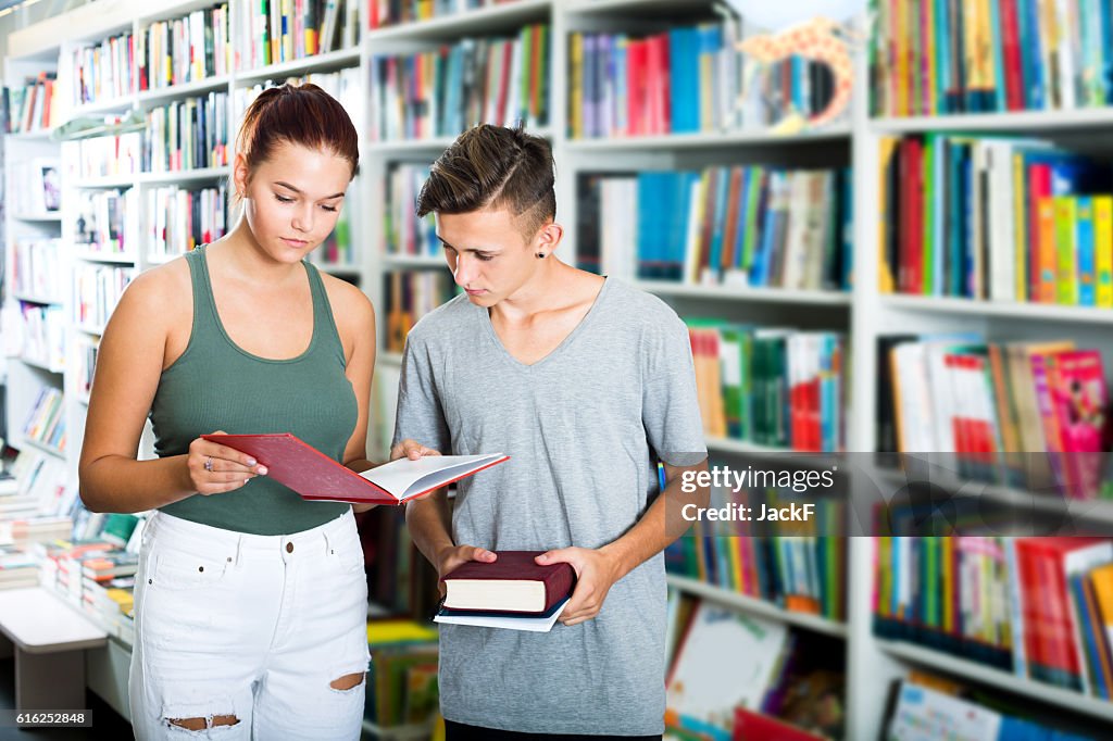 Girl and boy in book store