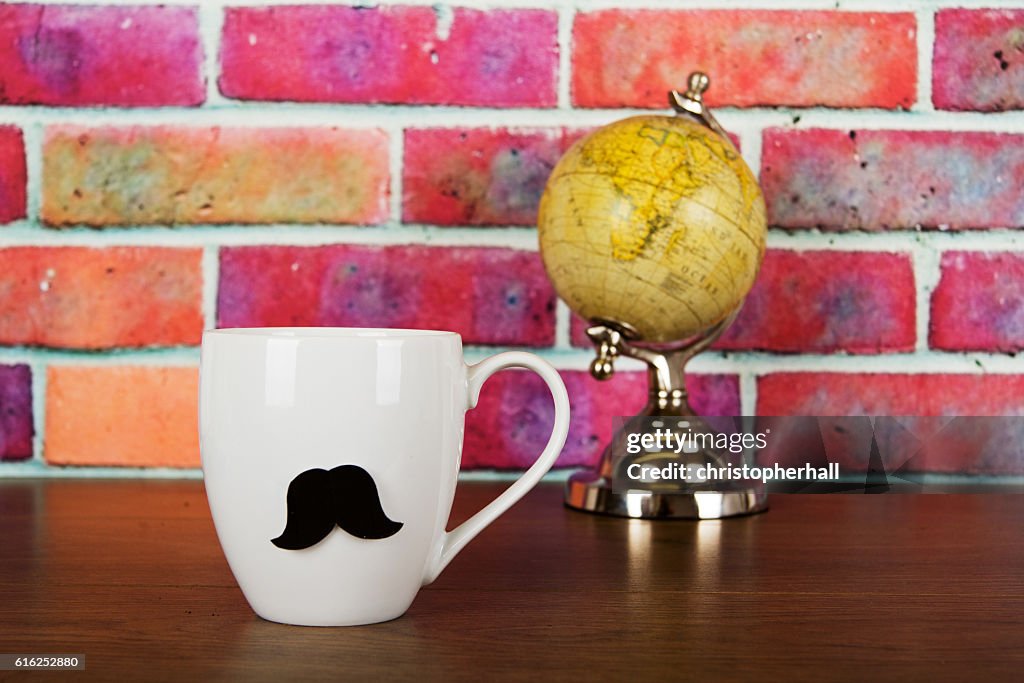 Coffee cup with a black hipster mustache