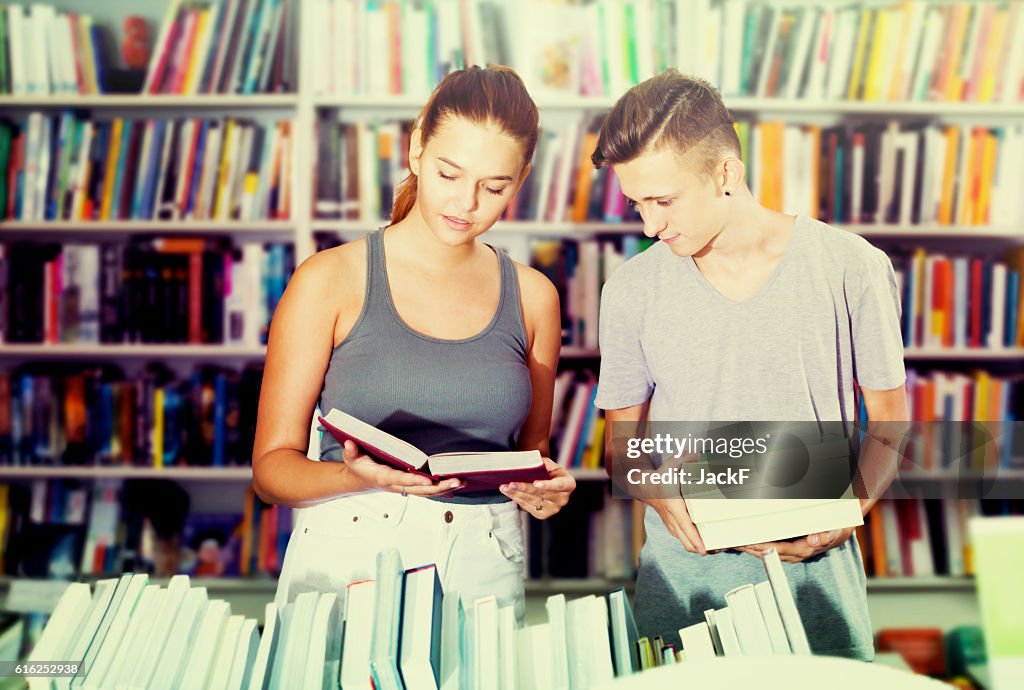 Girl and boy in book store