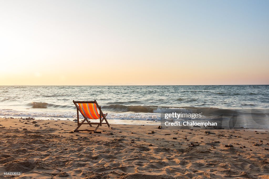 Beach chair with sunset