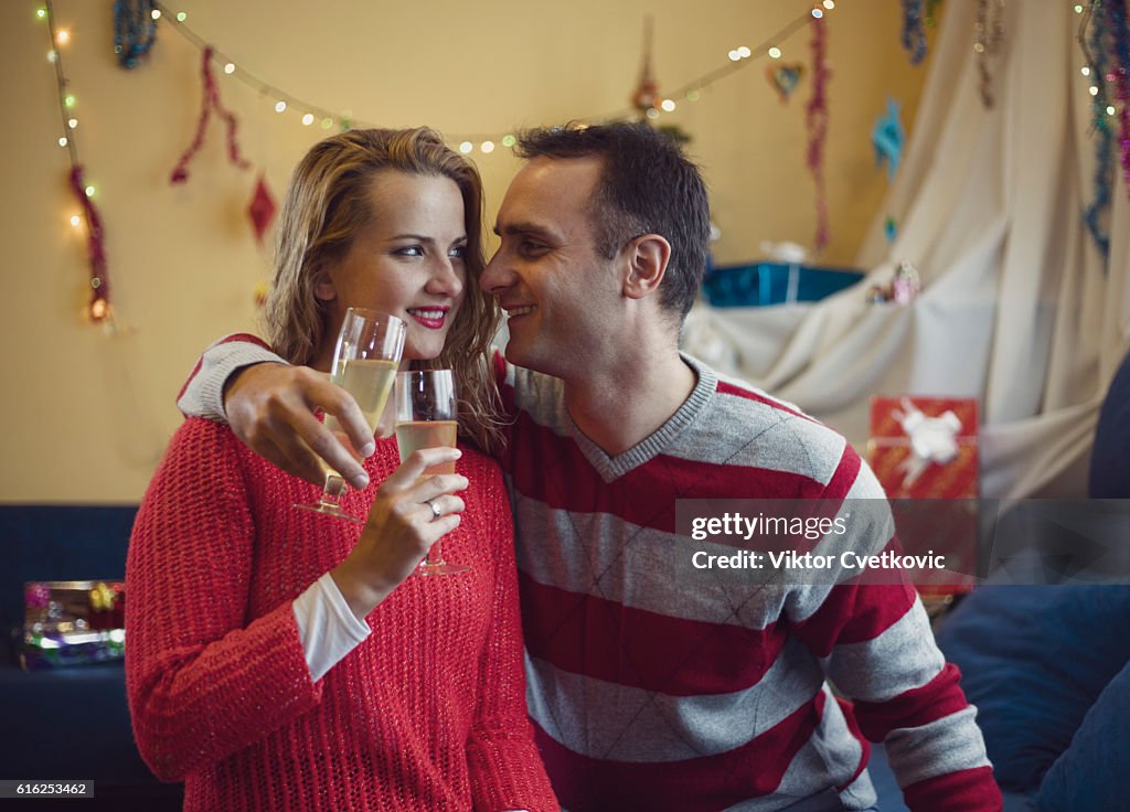 Happy couple in love at Christmas time and New Year.