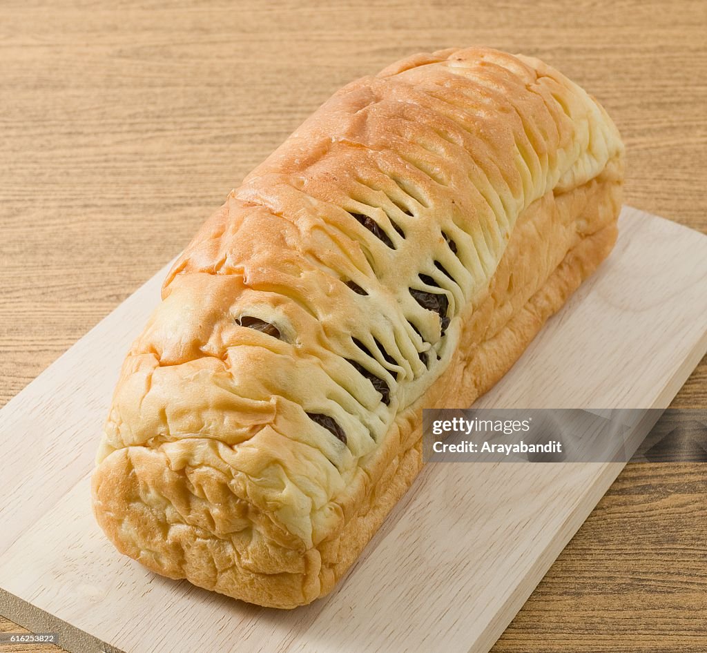 Raisin Bread on A Wooden Cutting Board