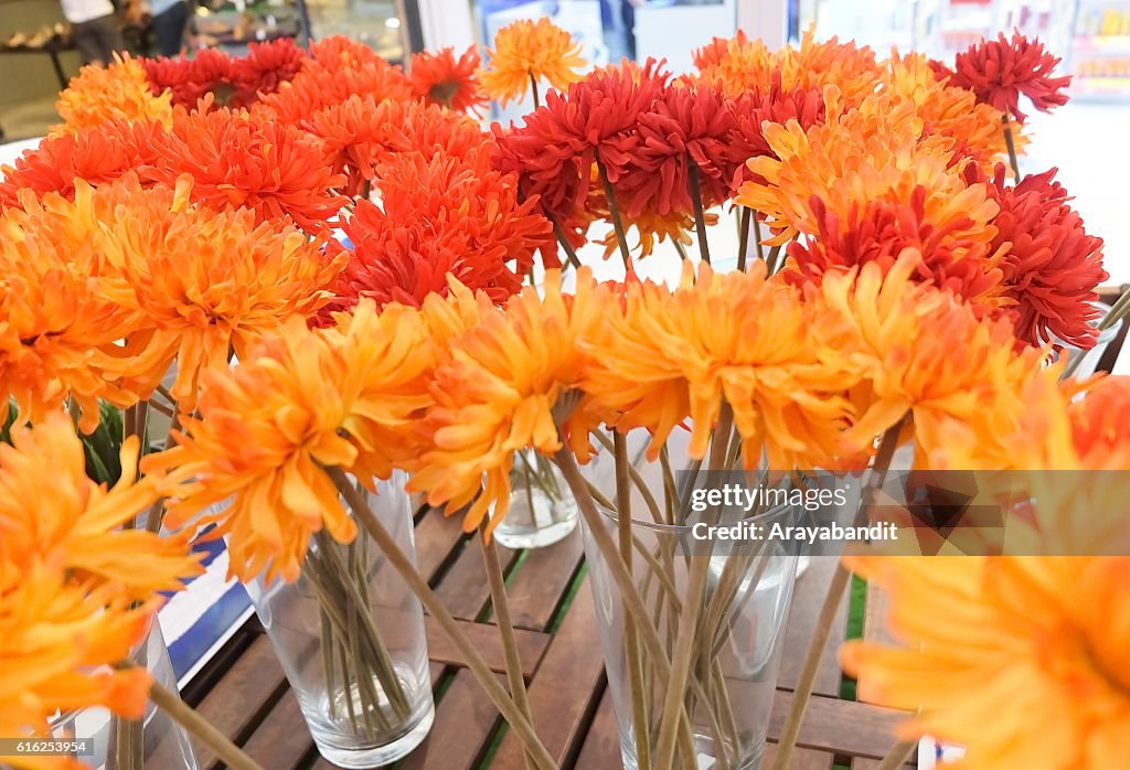 Orange Artificial Gerbera Flowers in Glass Vase