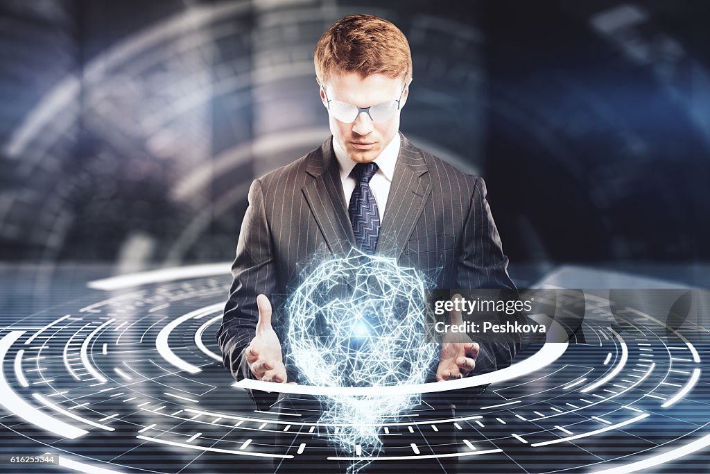 Businessman holding digital model