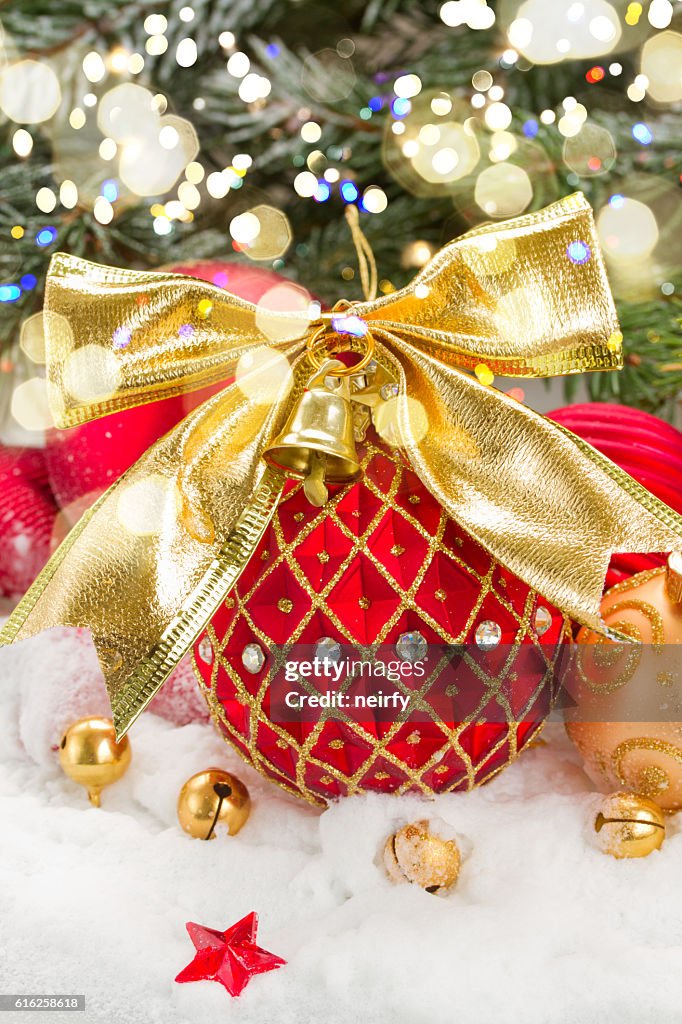 Red christmas ball with golden bow