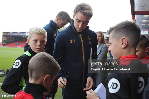 Christian Eriksen of Tottenham Hotspur meets mascots prior to kick off during the Premier League match between AFC Bournemouth and Tottenham Hotspur...