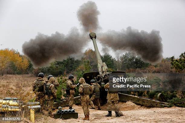 Ukrainian servicemen fire a 152mm 'Msta B' howitzers during a military exercises on the Devichki shooting range, about 85 km of capital Kyiv, Ukraine.