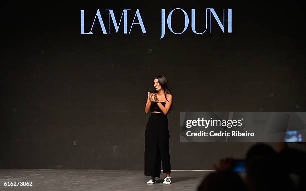 Designer Lama Jouni poses on the runway after her show during Fashion Forward Spring/Summer 2017 held at the Dubai Design District on October 22,...