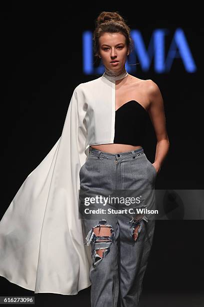 Model walks the runway during the Lama Jouni show at Fashion Forward Spring/Summer 2017 held at the Dubai Design District on October 22, 2016 in...