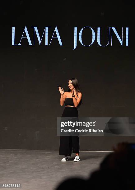 Designer Lama Jouni poses on the runway after her show during Fashion Forward Spring/Summer 2017 held at the Dubai Design District on October 22,...