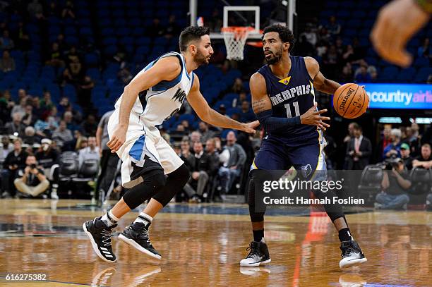 Ricky Rubio of the Minnesota Timberwolves guards against Mike Conley of the Memphis Grizzlies during the preseason game on October 19, 2016 at Target...