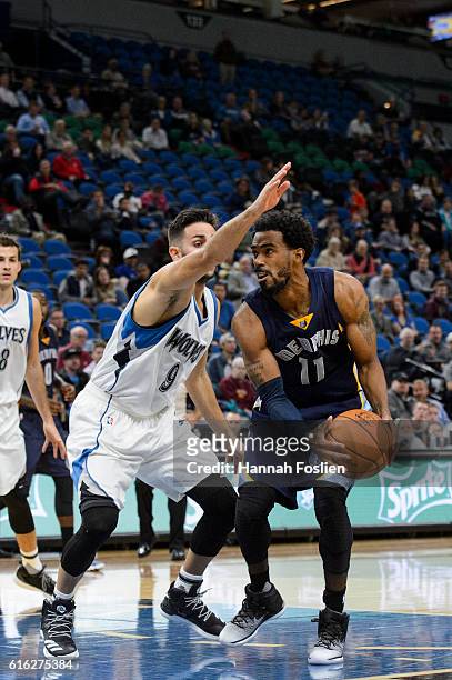 Ricky Rubio of the Minnesota Timberwolves guards against Mike Conley of the Memphis Grizzlies during the preseason game on October 19, 2016 at Target...