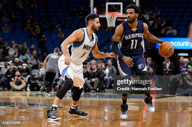 Ricky Rubio of the Minnesota Timberwolves guards against Mike Conley of the Memphis Grizzlies during the preseason game on October 19, 2016 at Target...