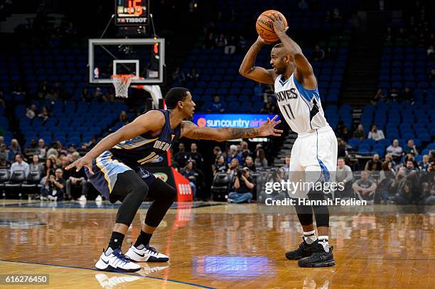 John Lucas III of the Minnesota Timberwolves controls the ball against Troy Williams of the Memphis Grizzlies during the preseason game on October...