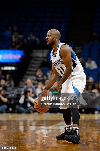 John Lucas III of the Minnesota Timberwolves dribbles the ball against the Memphis Grizzlies during the preseason game on October 19, 2016 at Target...