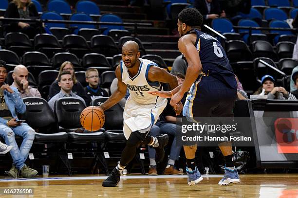 John Lucas III of the Minnesota Timberwolves drives to the basket against Chris Crawford of the Memphis Grizzlies during the preseason game on...