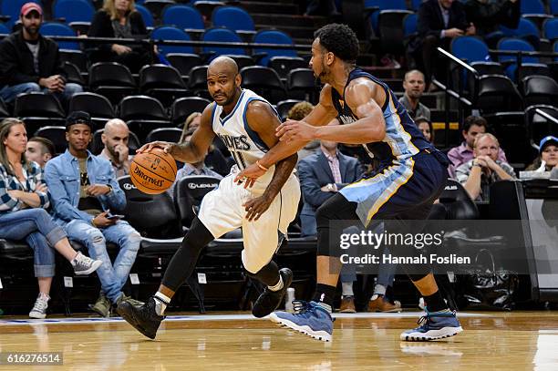 John Lucas III of the Minnesota Timberwolves drives to the basket against Chris Crawford of the Memphis Grizzlies during the preseason game on...