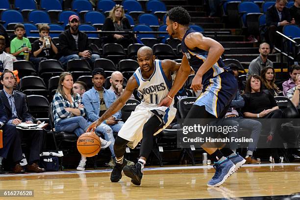 John Lucas III of the Minnesota Timberwolves drives to the basket against Chris Crawford of the Memphis Grizzlies during the preseason game on...