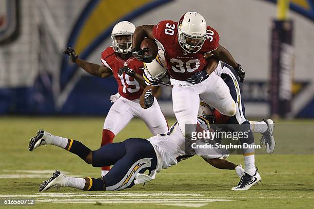 Running back Stepfan Taylor of the Arizona Cardinals leaps as he carries the ball against the San Diego Chargers during preseason at Qualcomm Stadium...