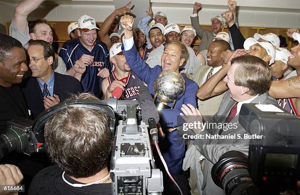 Principal Owner of the New Jersey Nets Lewis Katz celebrates receiving the Eastern Conference Championship Trophy along with the team after they...