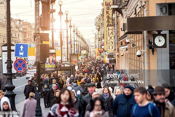 people walking along nevsky prospekt street. - nevsky prospekt stock pictures, royalty-free photos & images