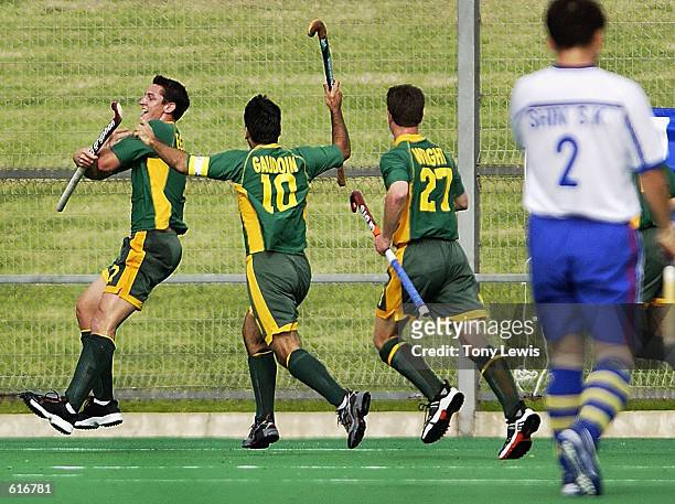 Nathan Eglington for Australia jumps for joy after he scored a goal in his first game for Australia, in the Four Nations Hockey match between...
