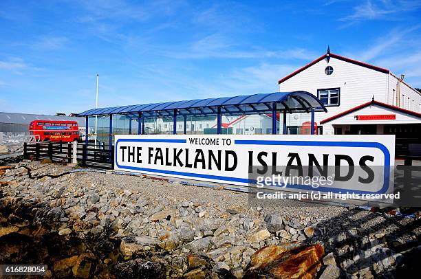 welcome sign in the harbour of stanley / falkland islands - falkland islands stock pictures, royalty-free photos & images