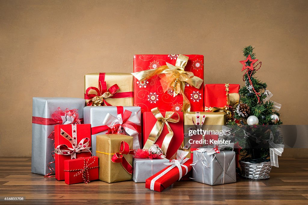 Stack of red, silver and golden gifts