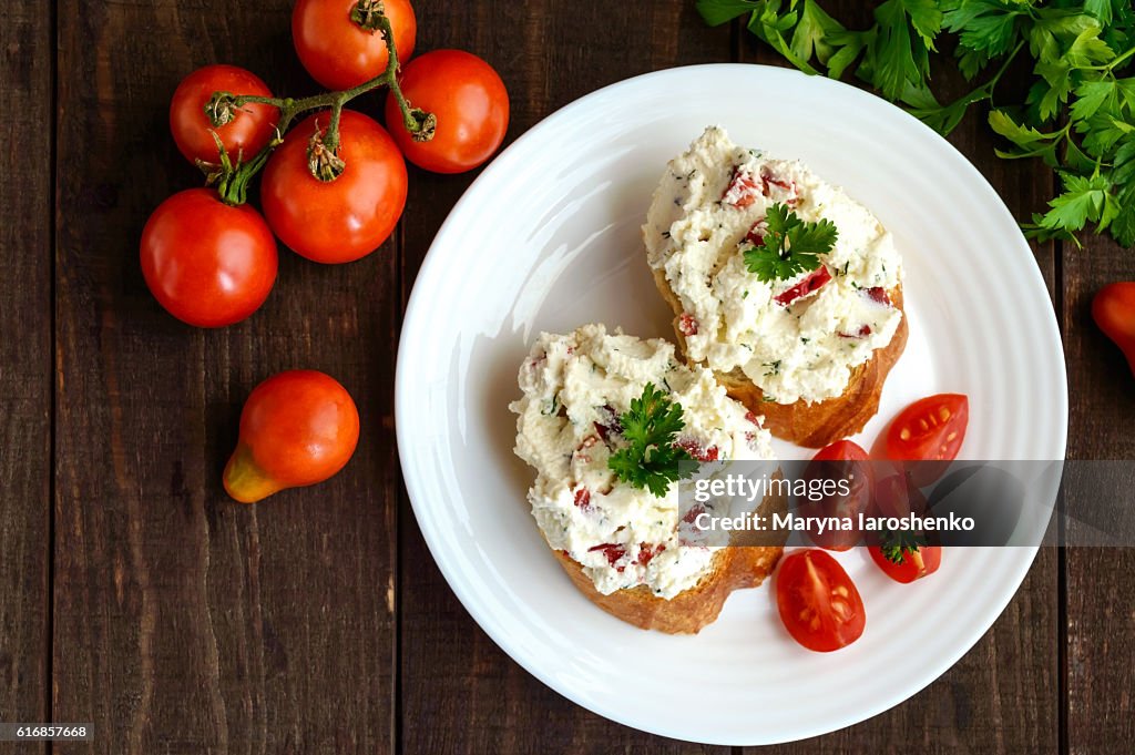 Sandwiches with pate cheese, garlic, slices of pepper, dill.