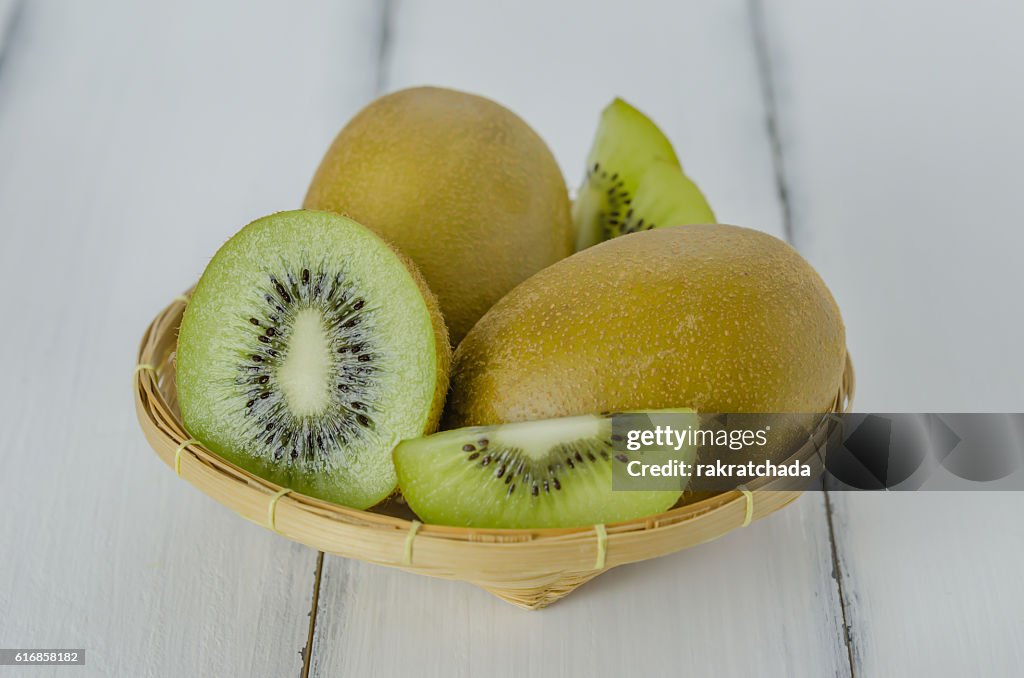 Kiwi fruit and sliced with bamboo basket