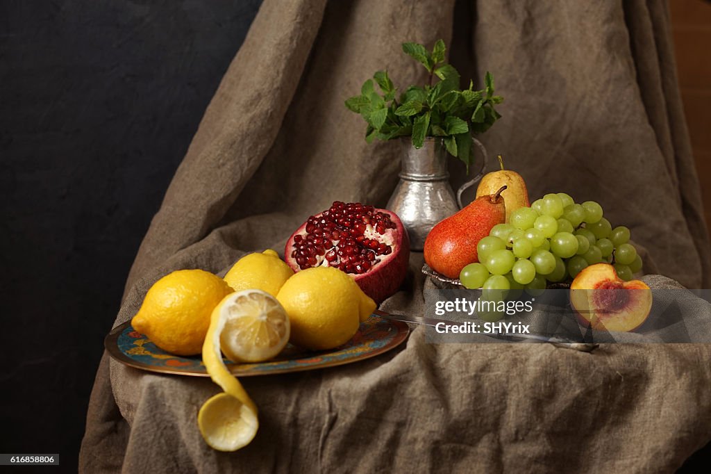 Still life in the Studio, pomegranate, grape, lemon.