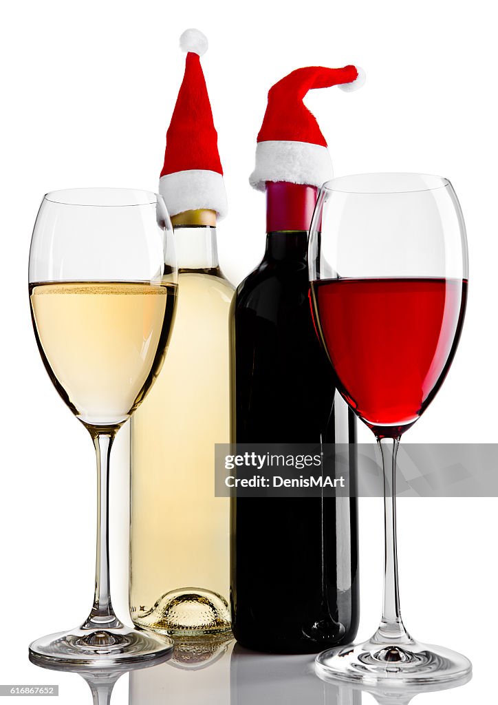 Bottles and glasses of red white wine santa hat