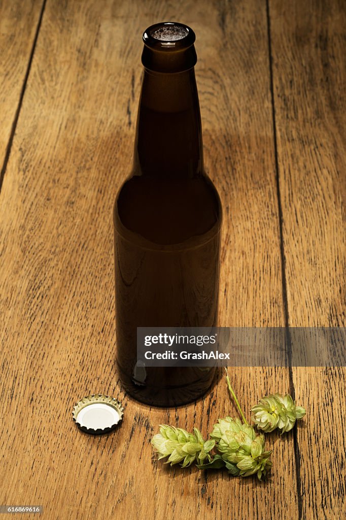 Beer bottles with fresh hops