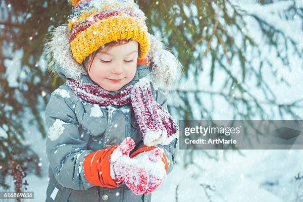 child in winter - kids playing snow stock pictures, royalty-free photos & images